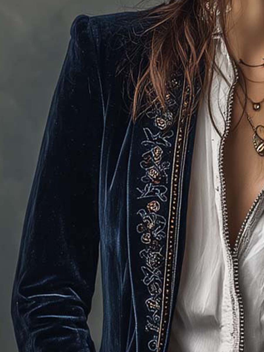 Woman wearing a long embroidered velvet jacket