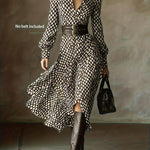 Woman wearing a rhombus print dress with belted waist