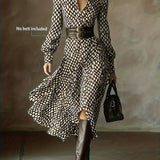 Woman wearing a rhombus print dress with belted waist