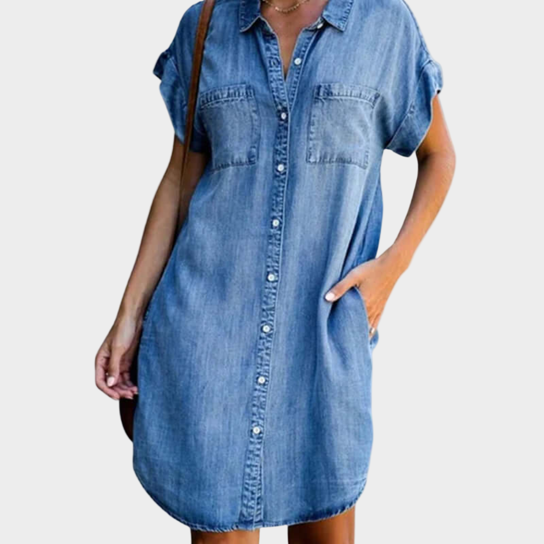 Woman wearing a loose-fit button-front denim dress