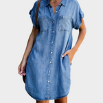 Woman wearing a loose-fit button-front denim dress