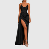 Woman wearing a satin maxi dress with thigh-high slit