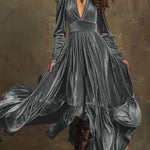 Woman wearing a deep V-neck pleated maxi dress