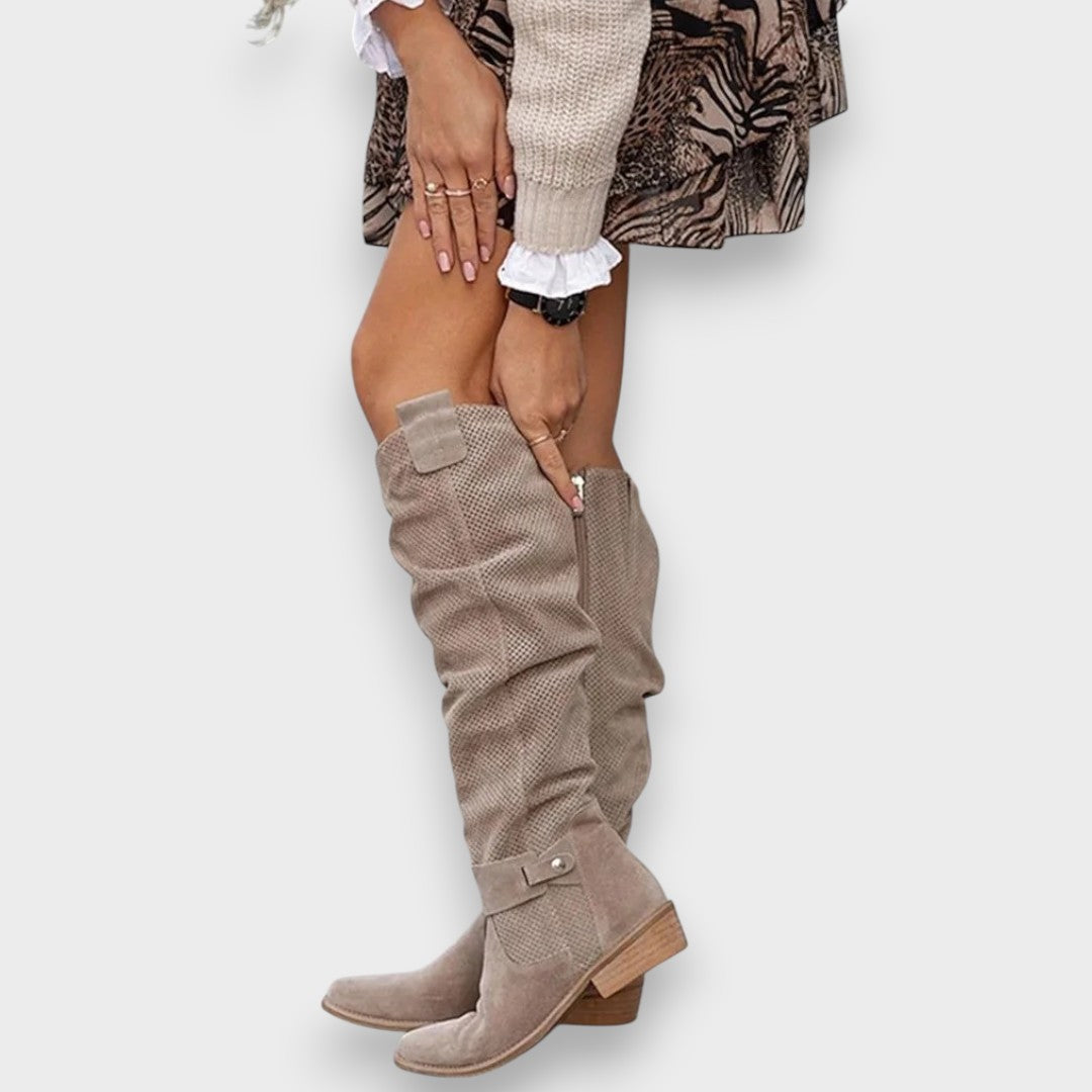 Estelle khaki slouchy suede knee-high boots, close-up with hand adjusting
