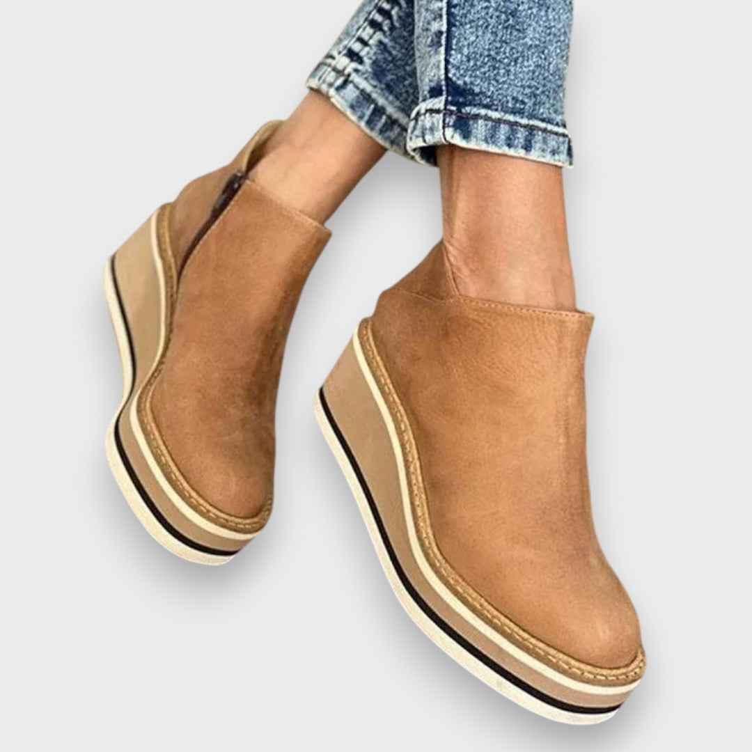 Maude Wedge Platform Ankle Boots in Brown leather-look, side view on model's ankles