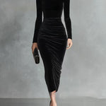 Woman wearing a black velvet fitted dress