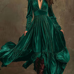 Woman wearing a deep V-neck pleated maxi dress