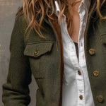 Woman wearing a herringbone blazer with contrast trim