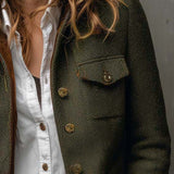 Woman wearing a herringbone blazer with contrast trim