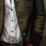 Woman wearing a herringbone blazer with contrast trim