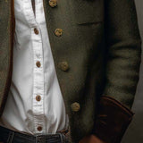 Woman wearing a herringbone blazer with contrast trim