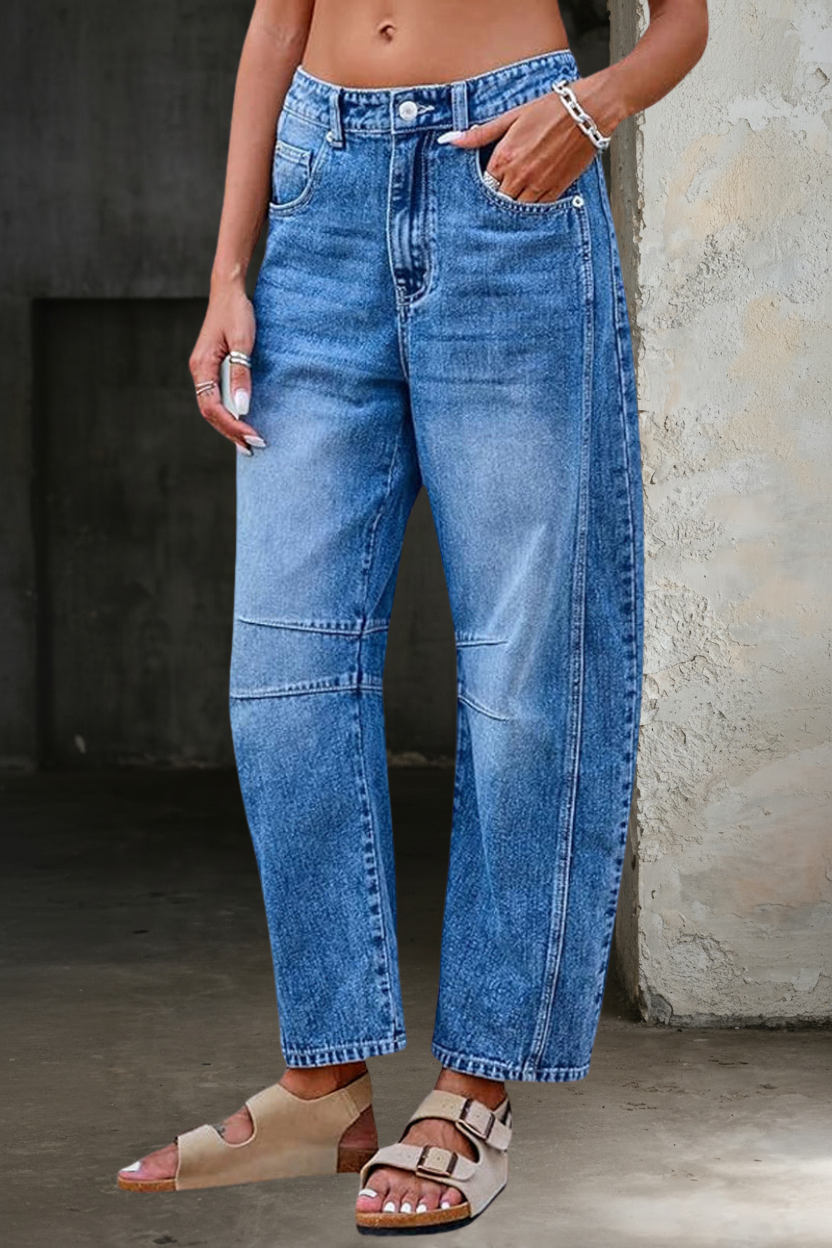 Woman wearing loose flare denim jeans with a flattering high-rise fit