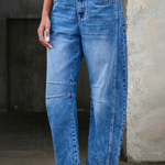 Woman wearing loose flare denim jeans with a flattering high-rise fit