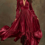 Woman wearing a deep V-neck pleated maxi dress