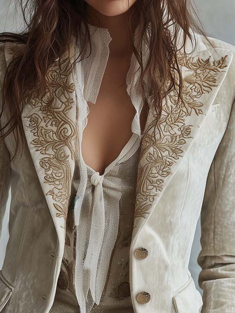 Woman wearing an ivory embroidered blazer