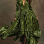 Woman wearing a deep V-neck pleated maxi dress