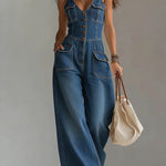 Woman wearing a relaxed-fit denim jumpsuit in a classic wash