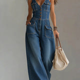 Woman wearing a relaxed-fit denim jumpsuit in a classic wash
