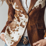 Woman wearing a vintage cow print blazer