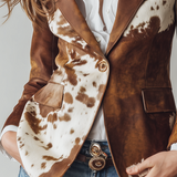 Woman wearing a vintage cow print blazer