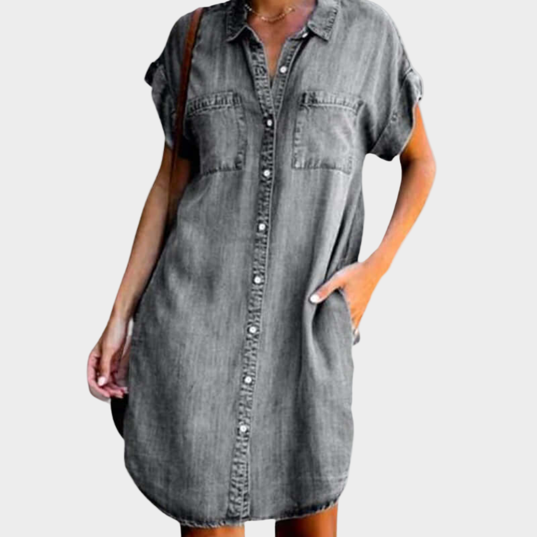 Woman wearing a loose-fit button-front denim dress
