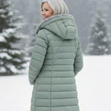 Woman wearing a fleece-lined quilted padded jacket with a shaped waist