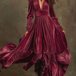 Woman wearing a deep V-neck pleated maxi dress