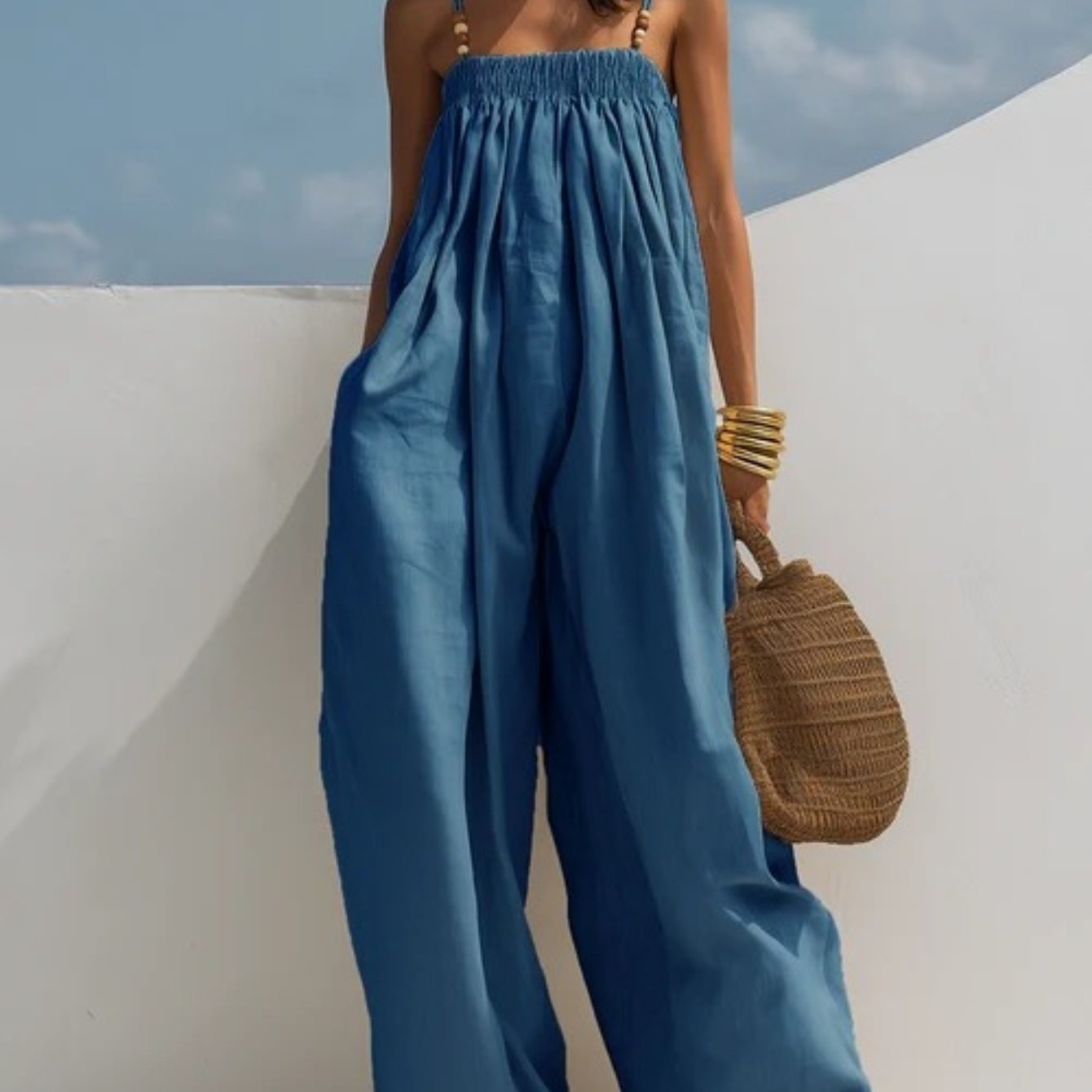 Woman wearing a wide-leg denim jumpsuit