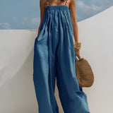 Woman wearing a wide-leg denim jumpsuit