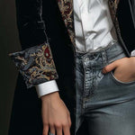 Woman wearing a long slim baroque print blazer