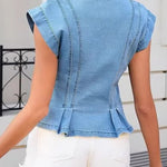 Woman wearing a sleeveless V-neck denim top
