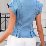 Woman wearing a sleeveless V-neck denim top