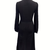Woman wearing a vintage-inspired winter dress with pockets