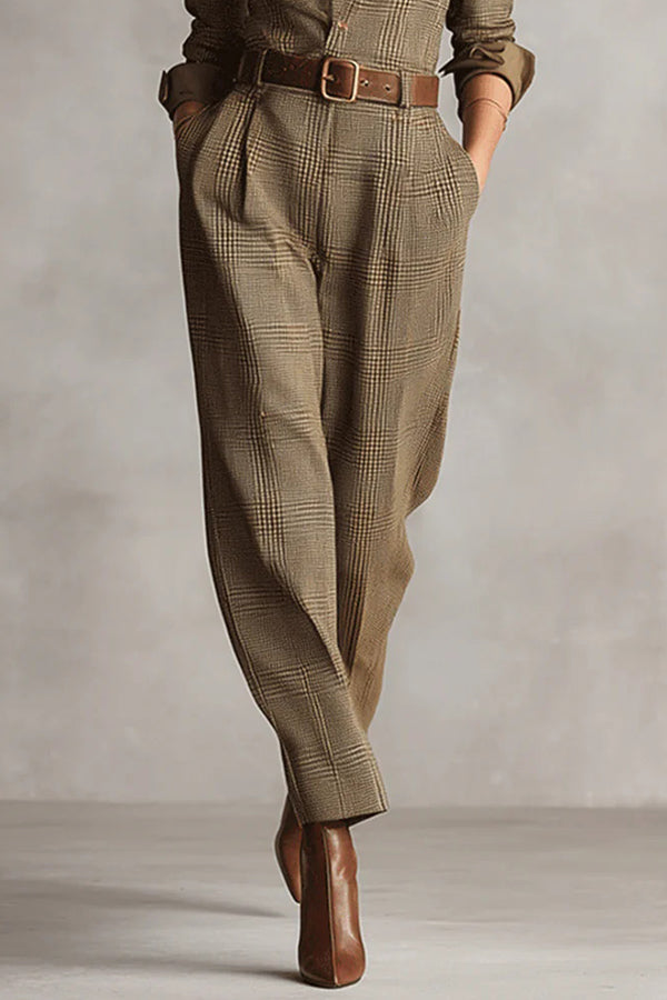 Woman wearing a tailored check jumpsuit with belt