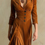 Woman wearing a button-front collar dress with 7/8 sleeves