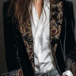 Woman wearing a long slim baroque print blazer