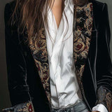 Woman wearing a long slim baroque print blazer