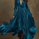 Woman wearing a deep V-neck pleated maxi dress