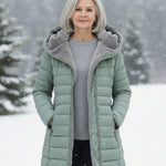 Woman wearing a fleece-lined quilted padded jacket with a shaped waist