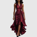 Woman wearing an evening wrap maxi dress with high slit