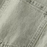 Woman wearing denim dungarees with a classic collar