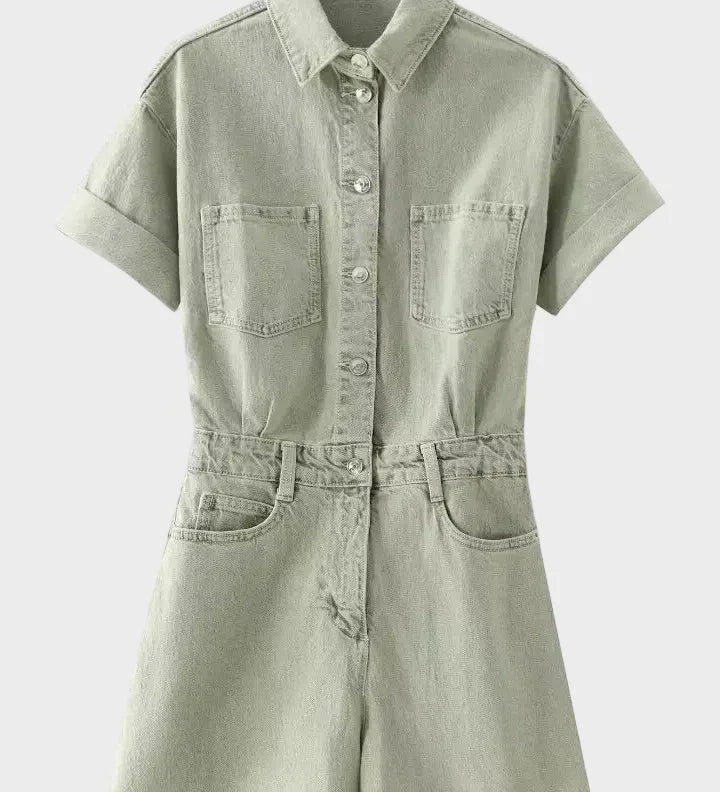 Woman wearing denim dungarees with a classic collar