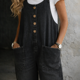Woman wearing washed cotton dungarees with side pockets