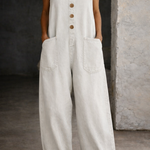 Woman wearing a washed cotton all-in-one with a square neckline