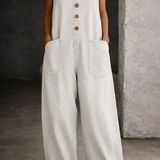 Woman wearing a washed cotton all-in-one with a square neckline