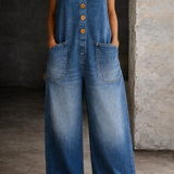 Woman wearing a washed cotton all-in-one with a square neckline