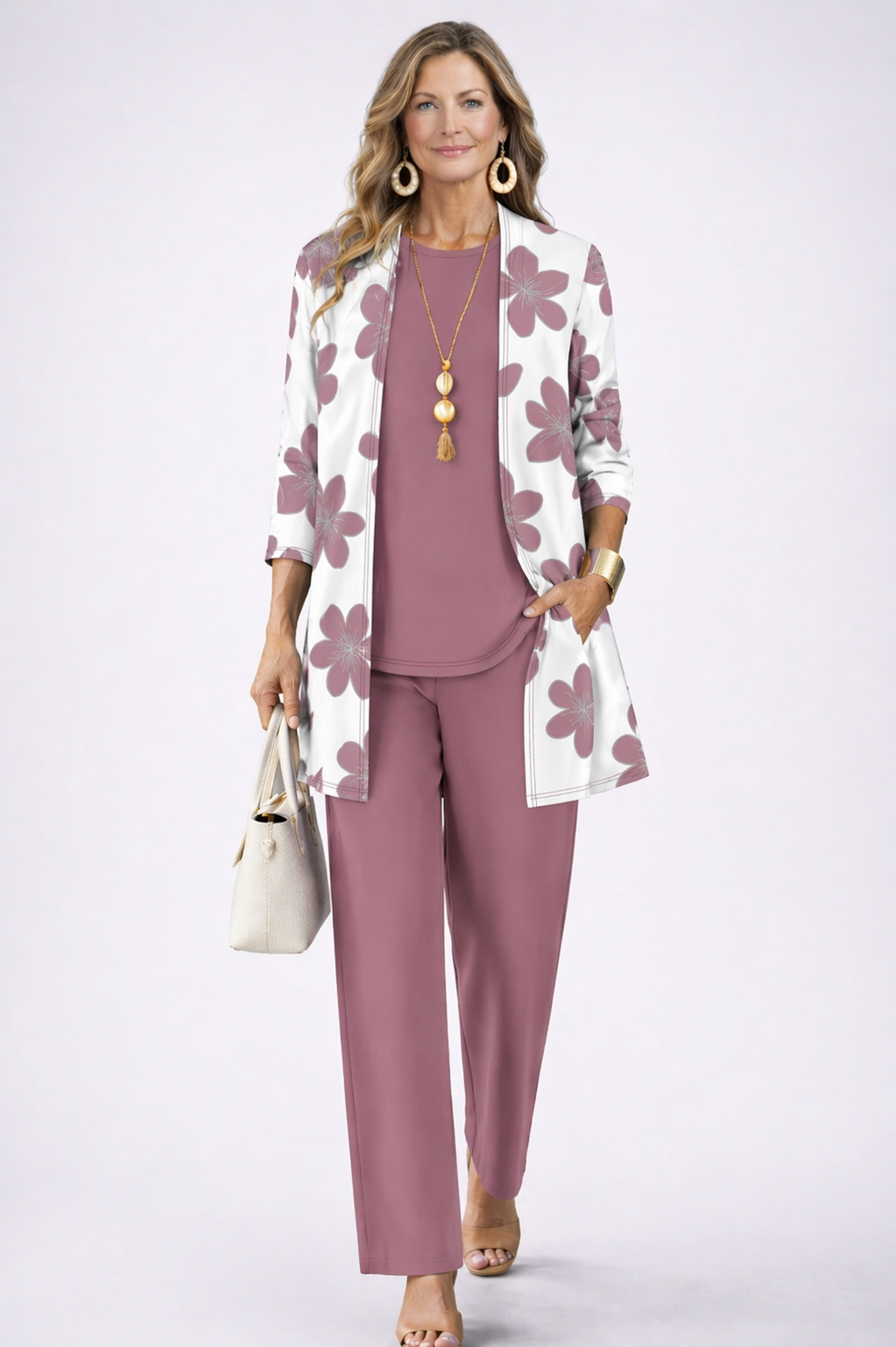 Woman wearing an orchid three-piece cardigan, top and trousers co-ord set