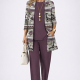 Woman wearing a dark mauve three-piece cardigan, top and trousers co-ord set
