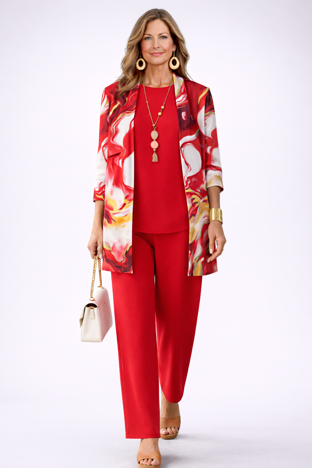 Woman wearing a red three-piece cardigan, top and trousers co-ord set