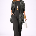 Woman wearing a black three-piece cardigan set with wide-leg trousers